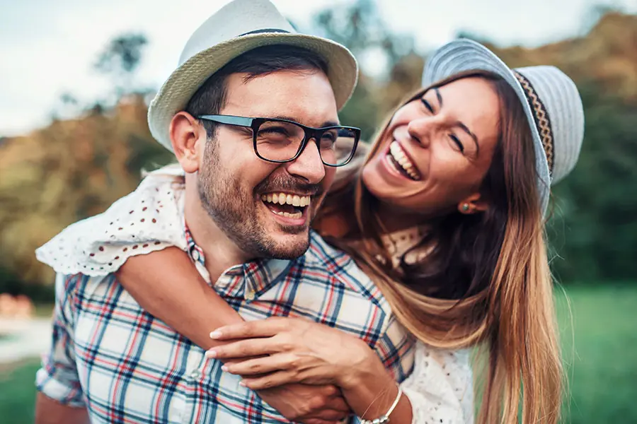 Happy couple enjoying a playful moment.