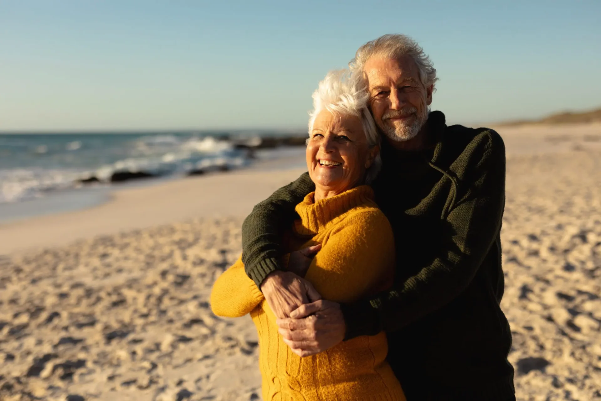 Happy couple embracing on beach