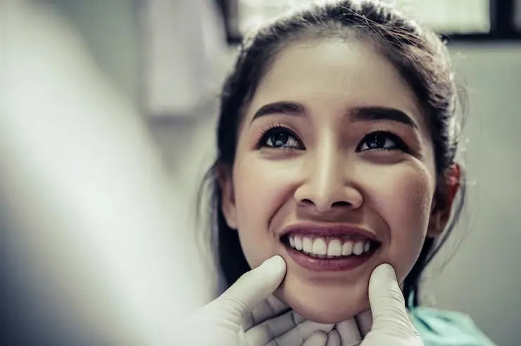 Smiling woman at dental appointment