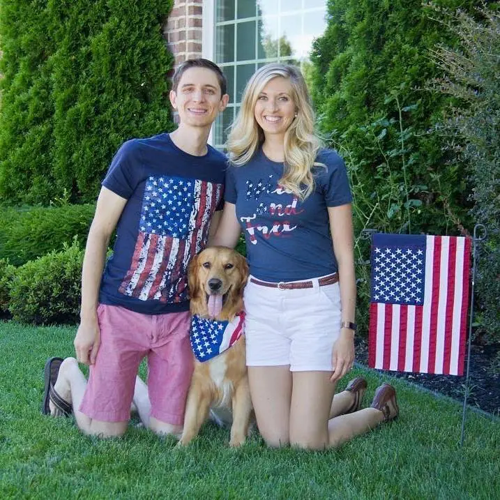 Couple with dog in patriotic attire