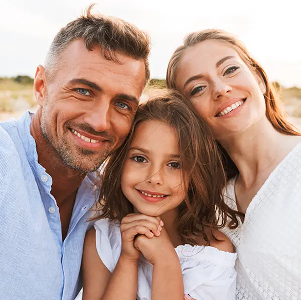 Happy family posing together outdoors