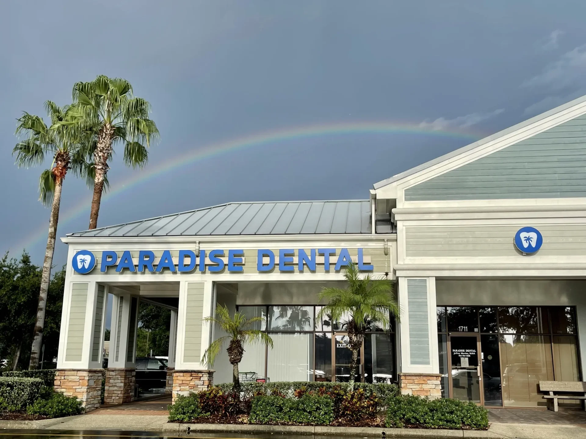 Dental office with rainbow backdrop.