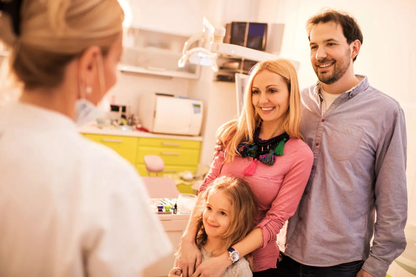 Family at dental office consultation