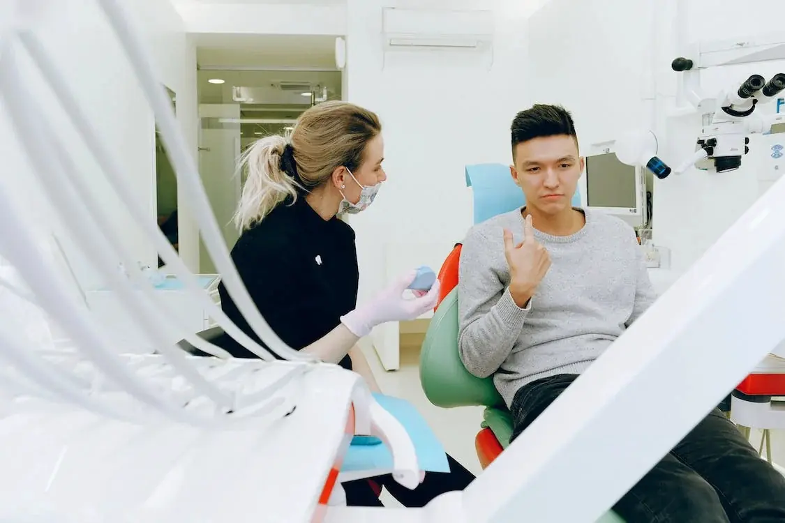 Dentist consulting with patient in clinic
