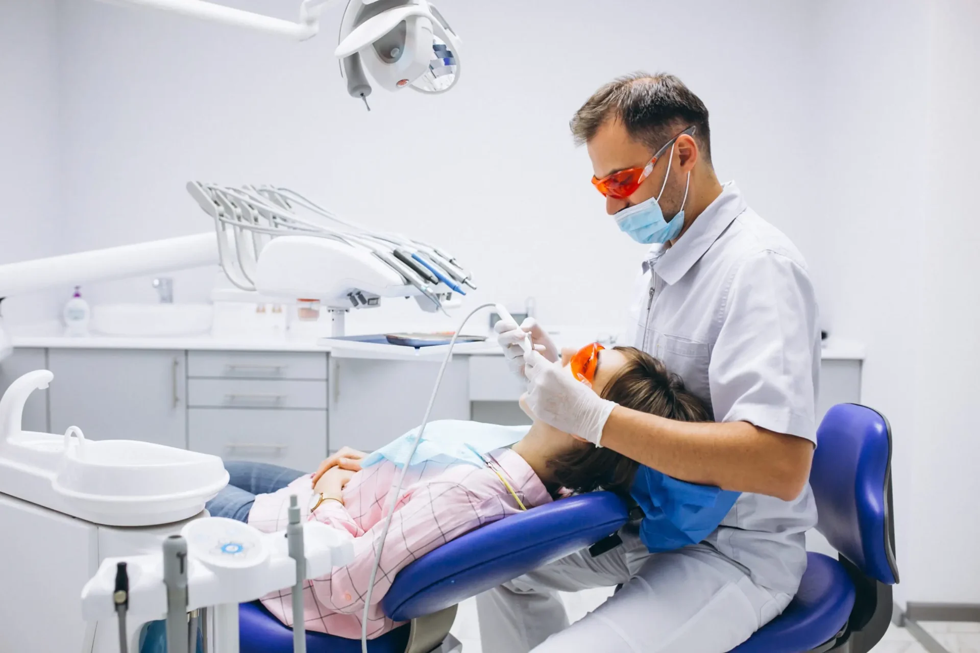 Dentist treating patient in clinic